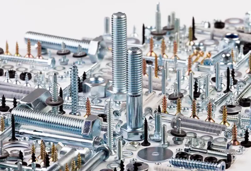 A close-up view of industrial fasteners and threaded hardware components