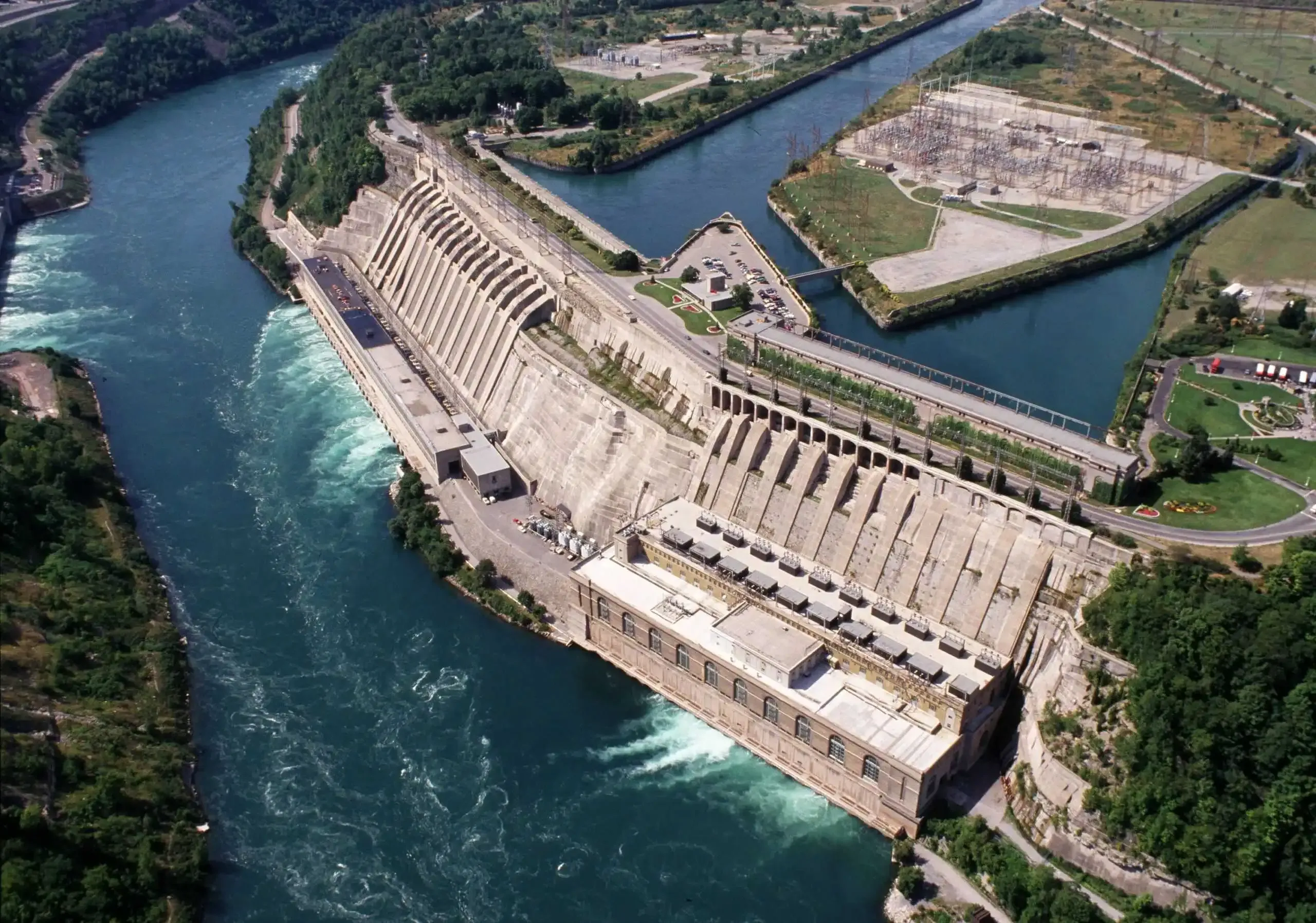 Aerial view of a hydroelectric dam and its surrounding waterways